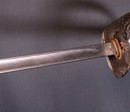 Sabre d'officier anglais du règne d'Édouard VII, avec fourreau gainé cuir et housse de protection en cuir.
