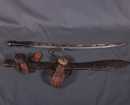 Lot de 2 armes africaines + un fourreau isolé.