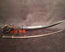 Sabre d'officier de cavalerie légère à la chasseur, Empire/ restauration. Lame bleuie dorée. Fourreau à garnitures laiton